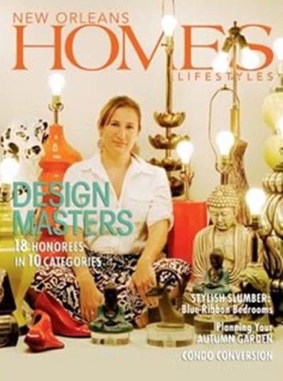 A woman sitting in front of lamps on the floor.