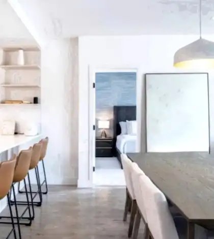 A room with a large table and chairs.